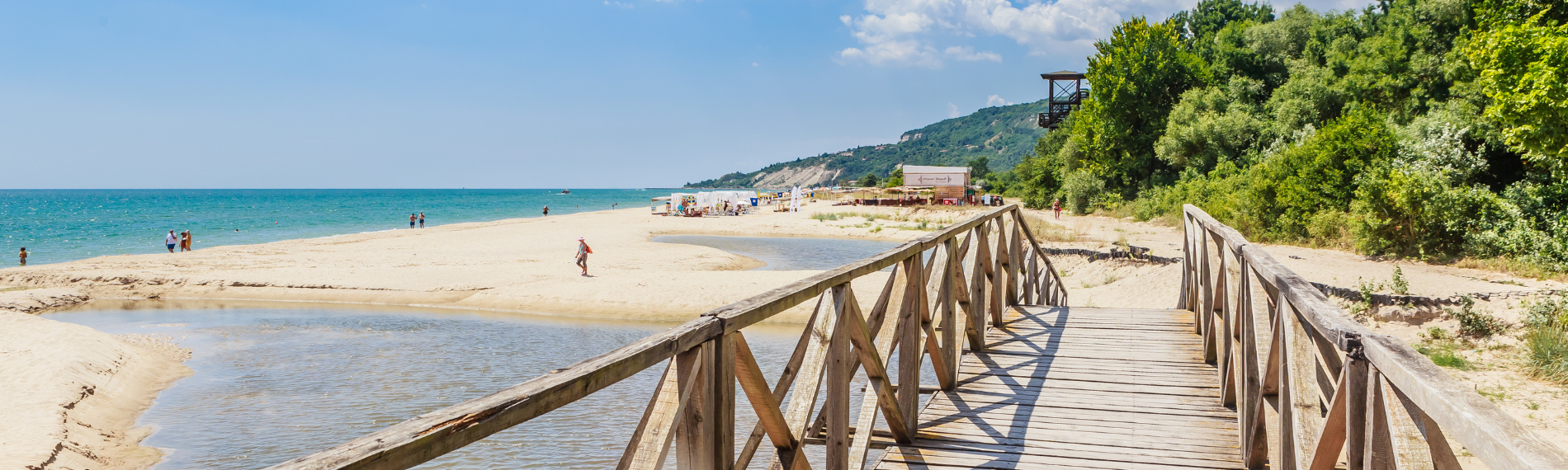 Wooden boardwalk crossing to the beach at Albena, a peaceful resort for Bulgaria holidays.
