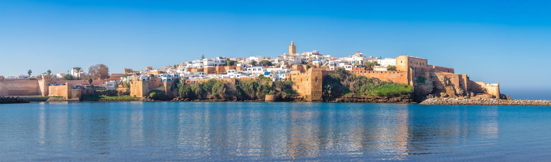 View of Rabat’s Kasbah of the Udayas with white houses and stone walls overlooking the Atlantic Ocean.