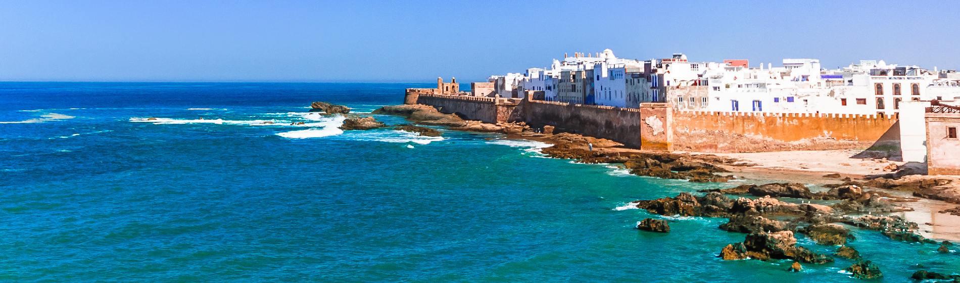 Seaside view of Essaouira’s old city walls and whitewashed buildings along the Atlantic coast.