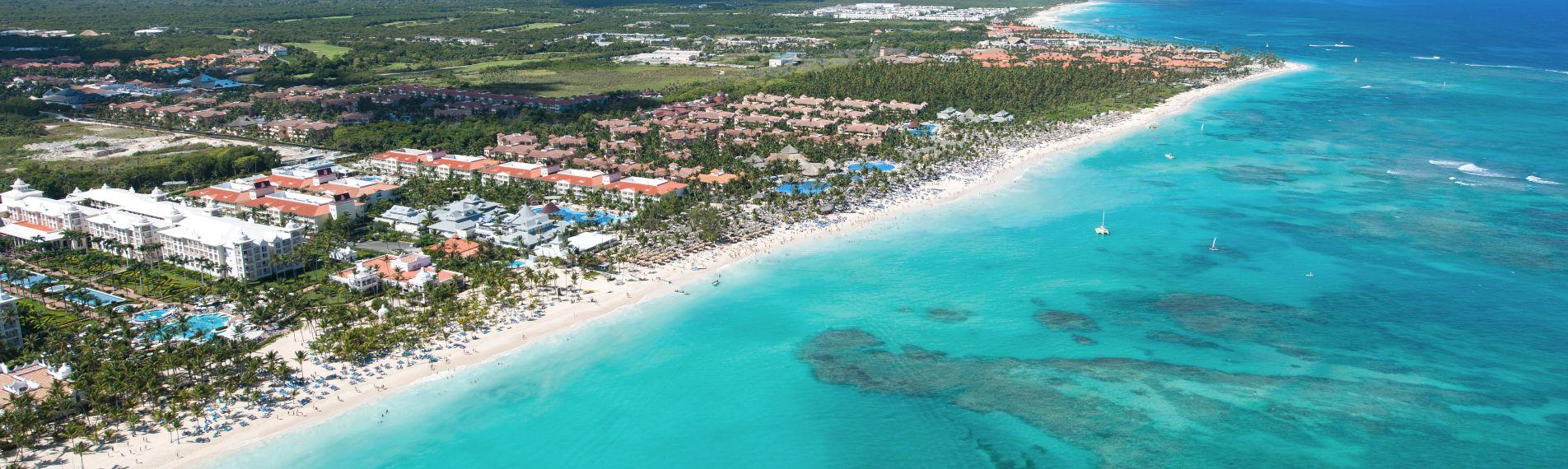 Aerial view of Punta Cana's hotel strip and Caribbean sea, a popular UK winter sun getaway.