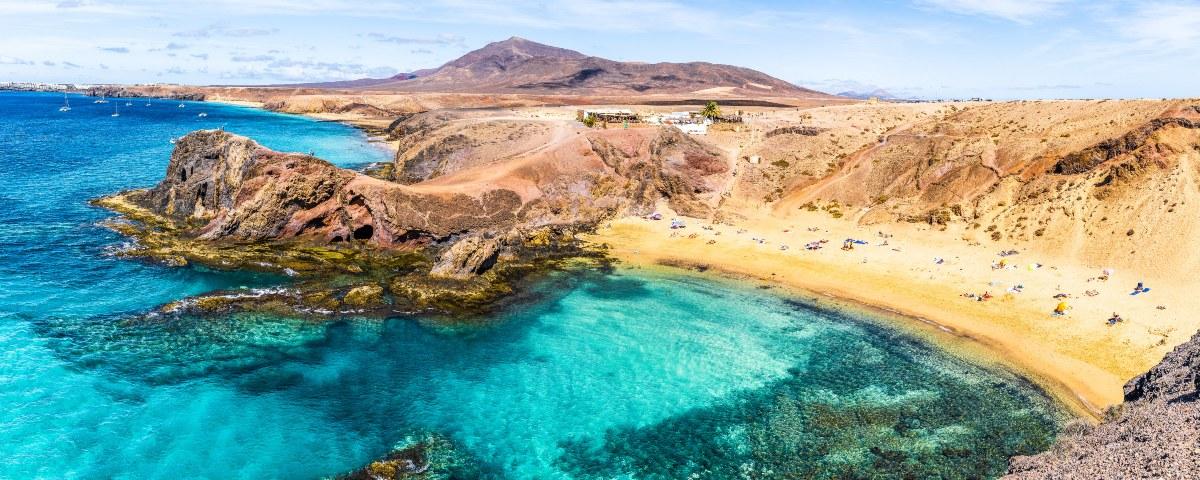 The beautiful Papagayo Beach in Lanzarote surrounded by turquoise waters