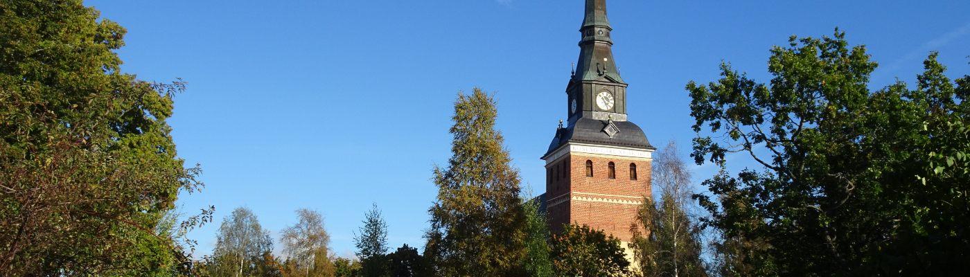 Church in Mora, Sweden surrounded by green trees