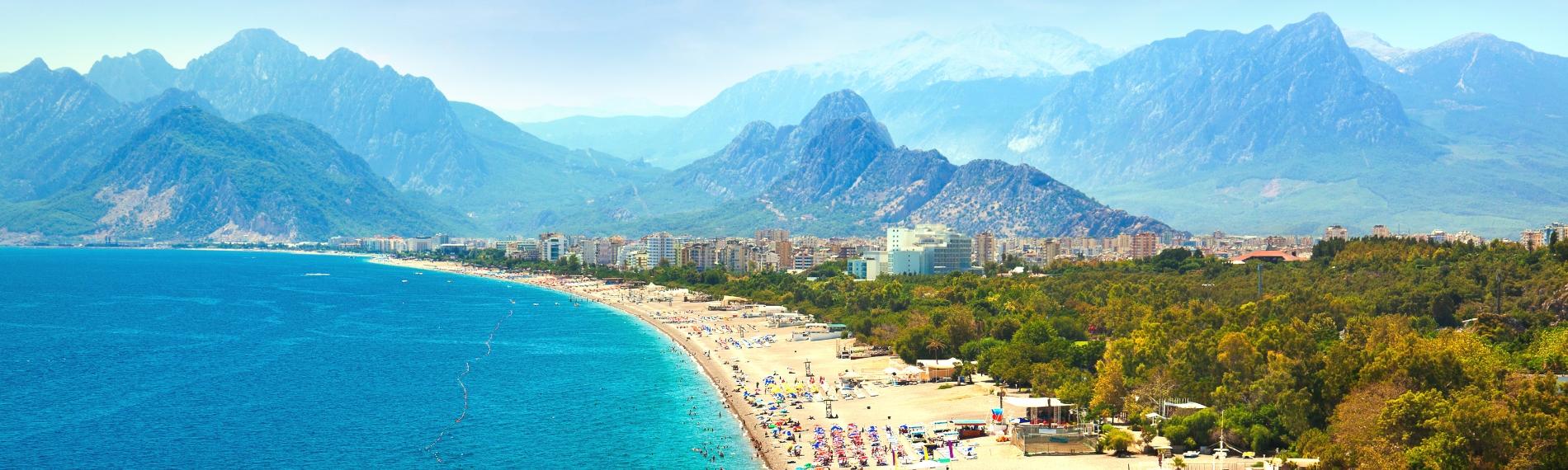 Konyaaltı Beach and the Taurus Mountains in Antalya, Turkey.