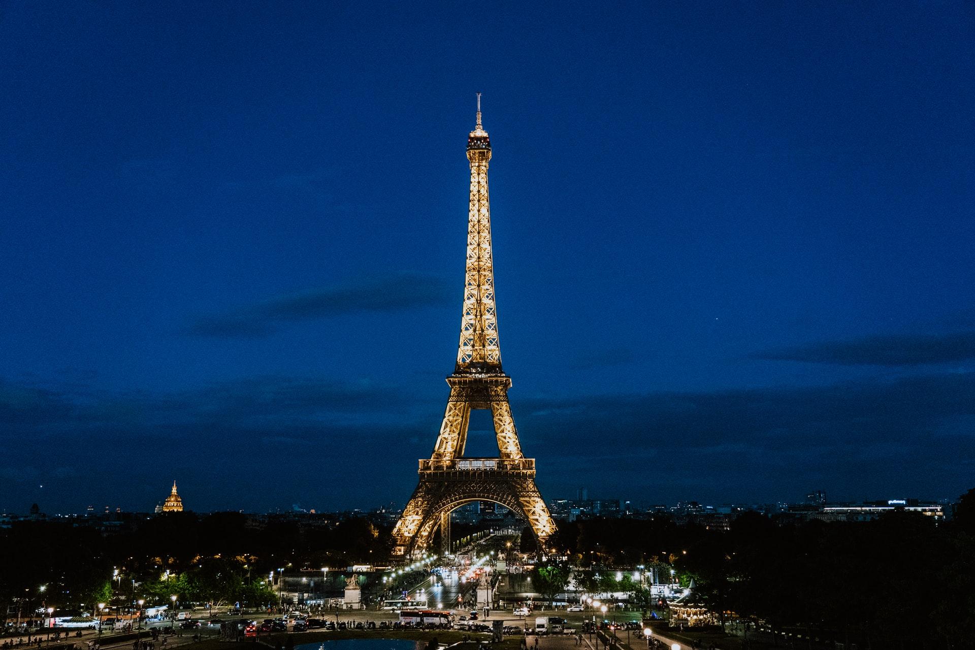 A view of the illuminated Eiffel Tower  at night