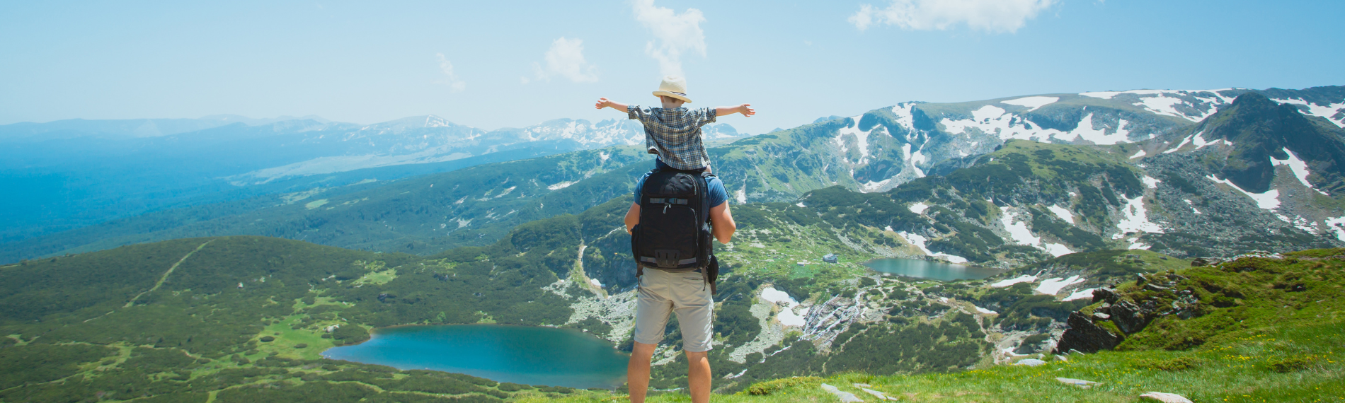 Father and child overlooking Rila mountain lakes, a scenic highlight of Bulgaria family holidays.