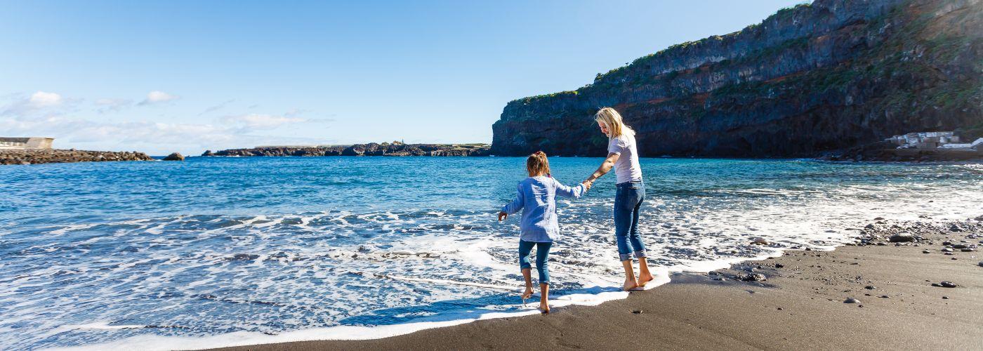Mother and child on beach in Tenerife