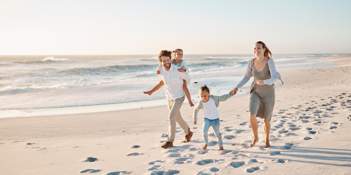 Family walking along a beach in Florida