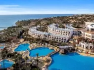 Sunny coastal resort with pools and sea views, perfect for an October holiday.