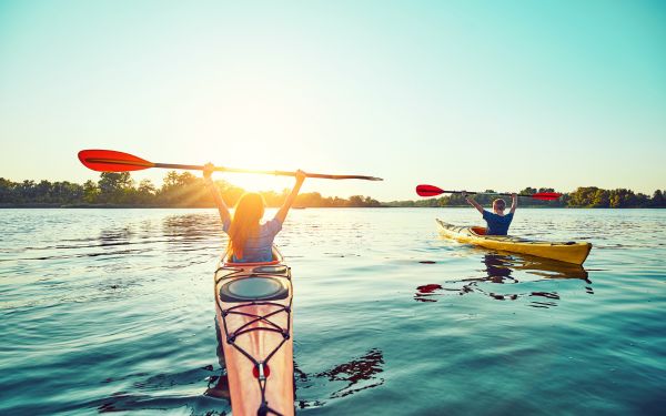 People kayaking at sunset