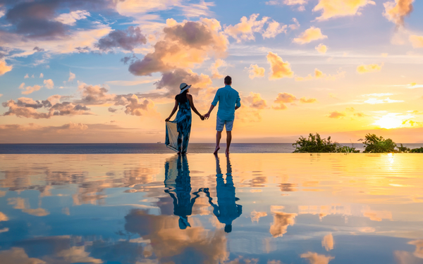 A couple watching the sunset for Valentine's in the Caribbean